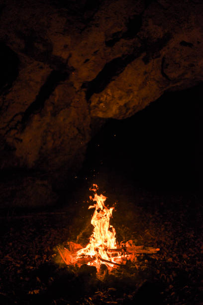 campfire in the cave. - blue flame natural gas fireplace imagens e fotografias de stock