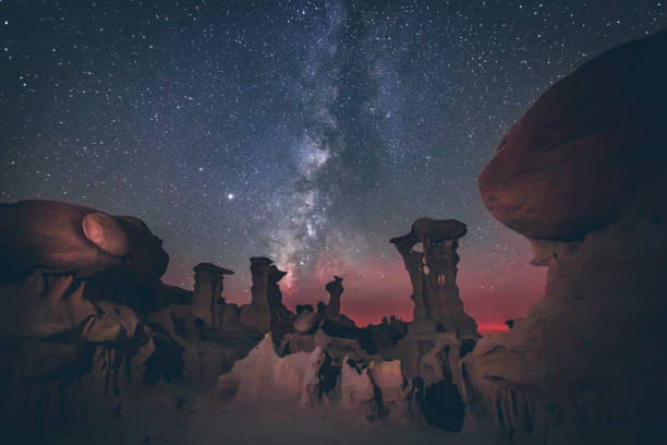 The Alien throne rock formation under the Milky Way, Bad Lands, New Me The Alien throne rock formation under the Milky Way, Bad Lands, New Me in Bloomfield, NM, United States desert wash stock pictures, royalty-free photos & images