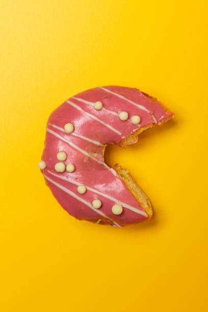 istock bitten strawberry plum donut 1309108533