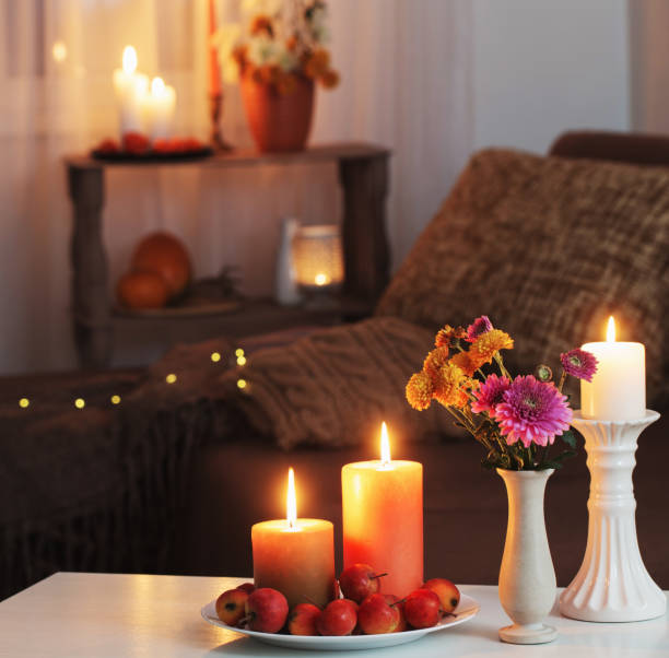 istock autumn decorations with burning candles at home 1309108806