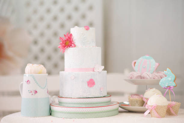 istock Easter tea table: handmade gingerbread cakes in the shape of a hare, toppers, marshmallows. 1309112817
