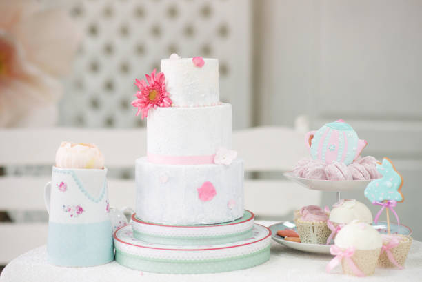 istock Easter tea table: handmade gingerbread cakes in the shape of a hare, toppers, marshmallows. 1309112820