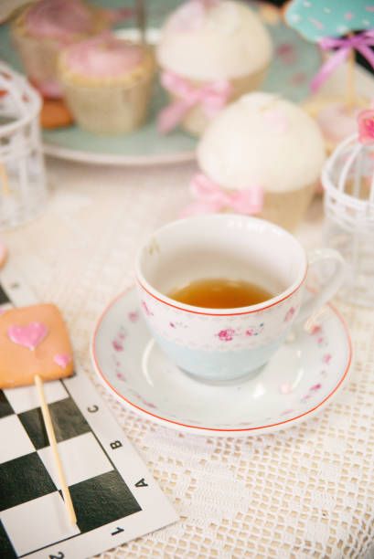 istock Easter tea table: handmade gingerbread cakes in the shape of a hare, toppers, marshmallows. 1309112827