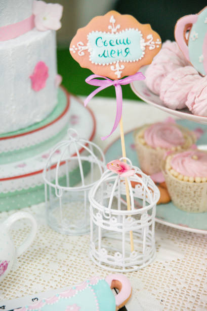 istock Easter tea table: handmade gingerbread cakes in the shape of a hare, toppers, marshmallows. 1309112832