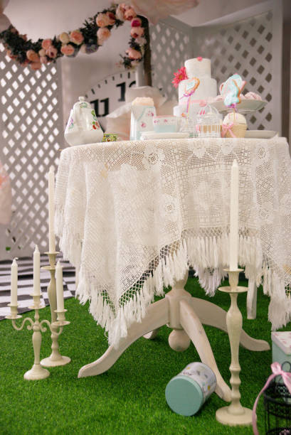 istock Easter tea table: handmade gingerbread cakes in the shape of a hare, toppers, marshmallows. 1309112853