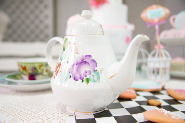 istock Easter tea table: handmade gingerbread cakes in the shape of a hare, toppers, marshmallows. 1309112864