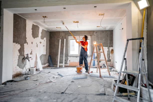 istock Man painting apartment walls 1309112984