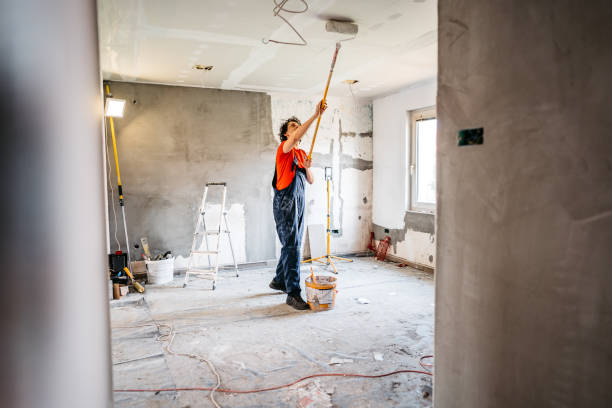 istock Man painting apartment walls 1309113092