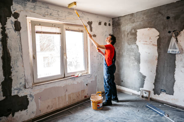 istock Man painting apartment walls 1309113160