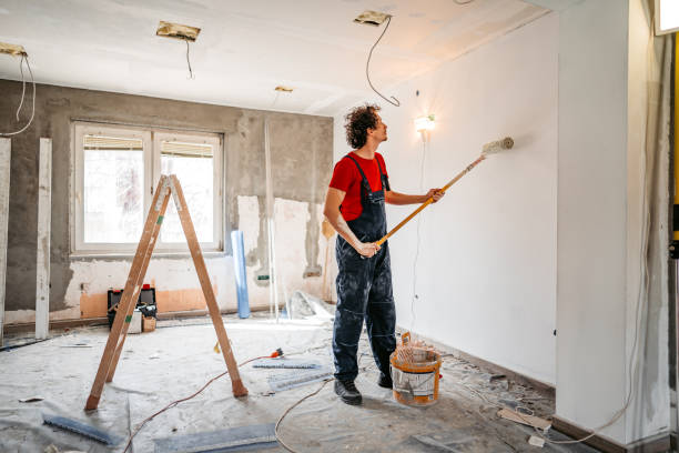 istock Man painting apartment walls 1309113188