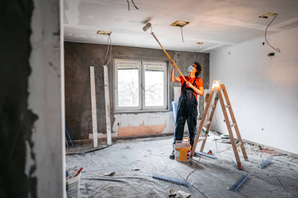 istock Man painting apartment walls 1309113283