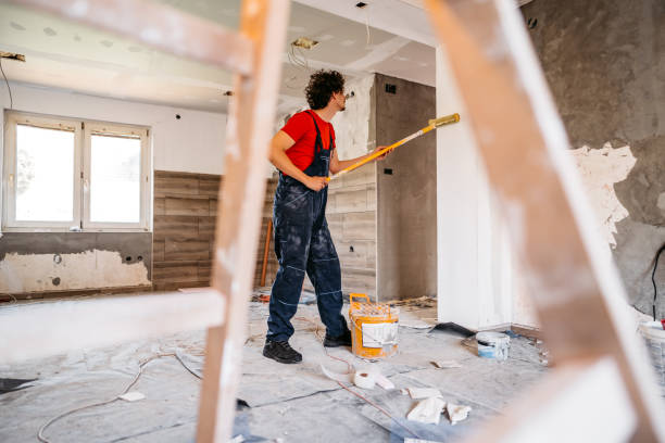 istock Man painting apartment walls 1309113410