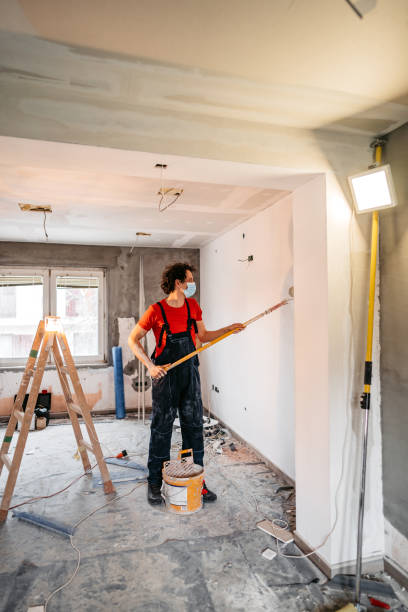 istock Man painting apartment walls 1309113425