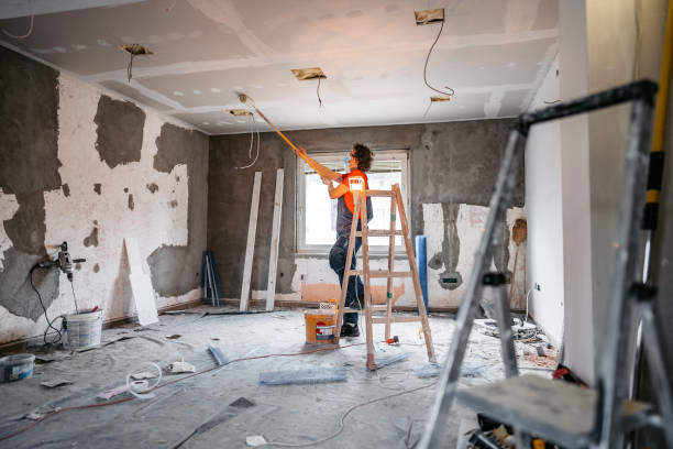 istock Man painting apartment walls 1309113455