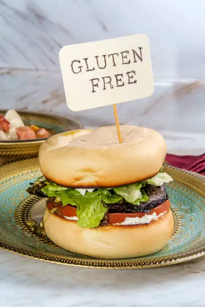 Portobello mushroom burger with pesto and goat cheese and side slow-cooker ham and cannellini bean soup