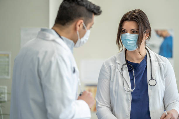 istock Two medical professionals meeting 1309114966