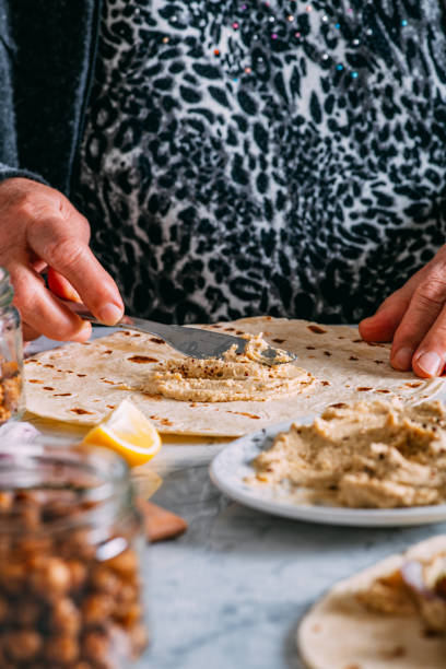 istock Woman is Preparing Vegan Wrap 1309115080