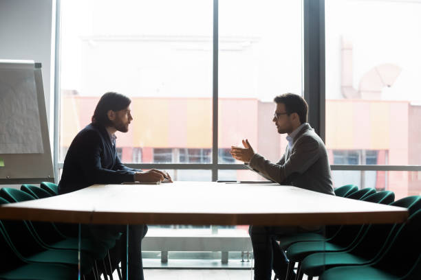 istock Focused confident young businessman making offer to partner. 1309116002