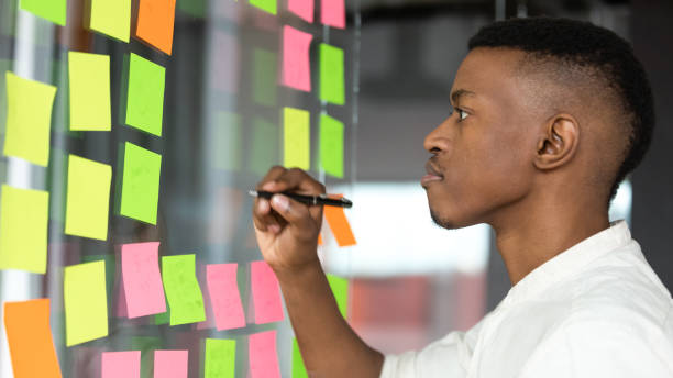 istock Concentrated african american male employee managing working tasks. 1309116030