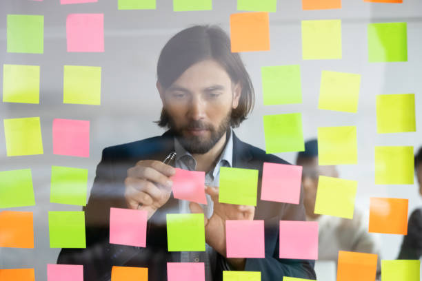 istock Concentrated 30s caucasian businessman managing working tasks. 1309116035
