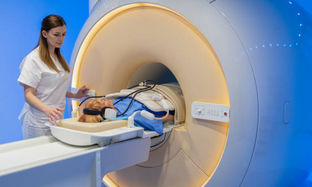 istock Doctor Preparing Patient For CT Scanner 1309117901