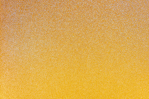 istock Abstract defocused gold glitter texture background with copy space for text or lettering. Minimal gradient composition. Mock up, festive background. 1309119480