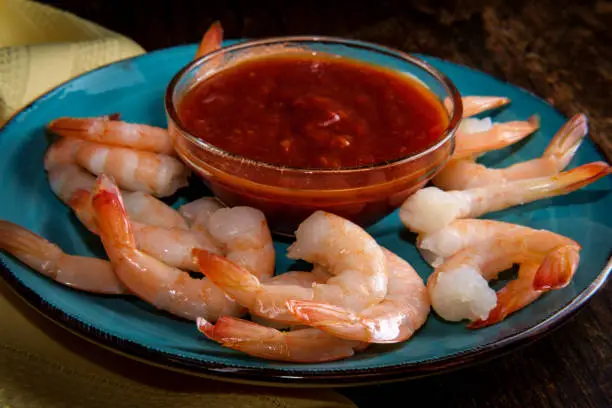 Delightful tail-on shrimp cocktail served with horseradish dipping sauce