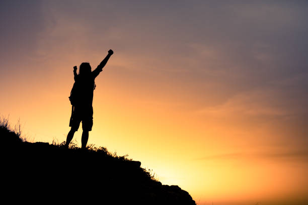 istock Man hiker enjoying his successful hike 1309121921
