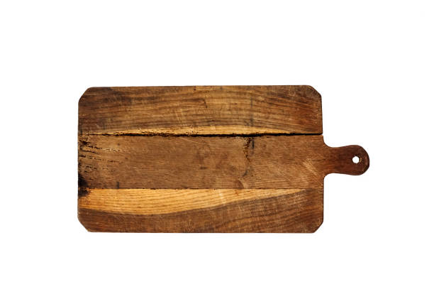 istock Old wooden cutting board isolated on white background 1309122442