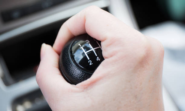 istock A woman's hand shifting a 5 speed gearshift. 1309123383