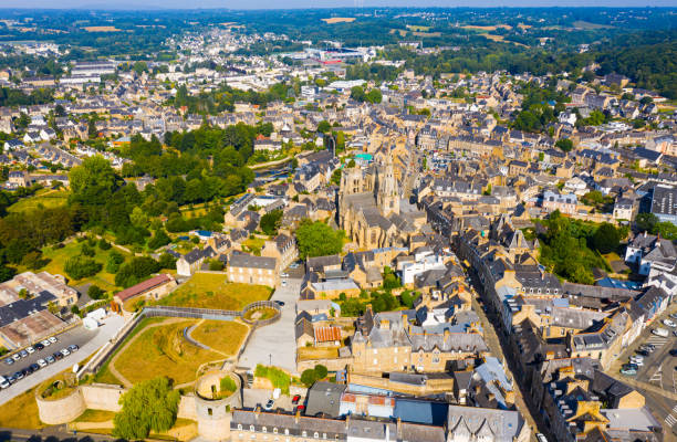 Aerial view of historic centre of Guingamp with Basilica and castle Aerial view of historic centre of Guingamp overlooking ancient Basilica of Notre Dame and former fortified castle, Brittany, France guingamp brittany stock pictures, royalty-free photos & images