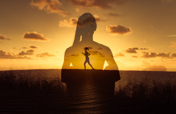 istock Woman running free in nature. 1309123874
