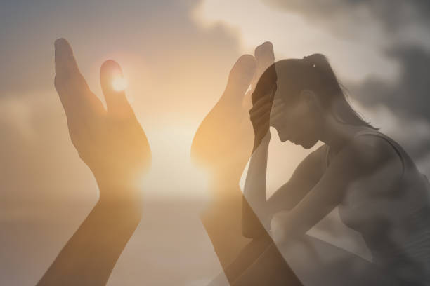 istock Sad woman praying asking god for help. 1309123954