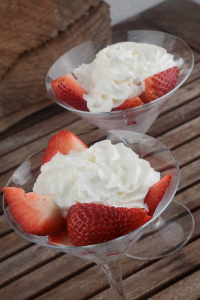 istock strawberries with fresh cream as gourmet dessert 1309124852