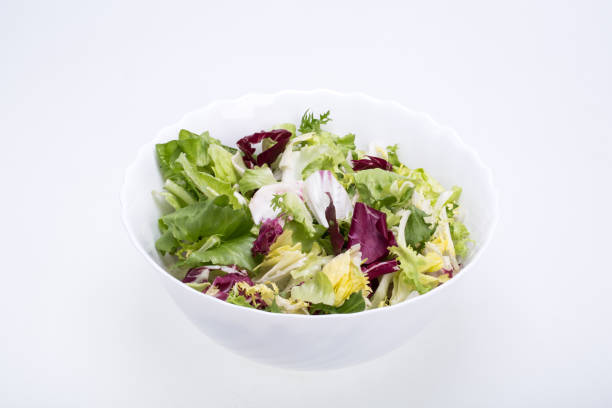 istock Green and red leaf of lettuce . Isolated on a white background 1309125506