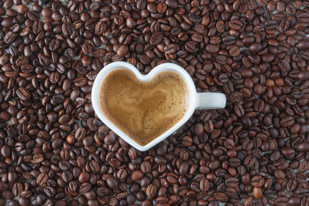 istock White cup shape heart of coffee on coffee beans 1309126247