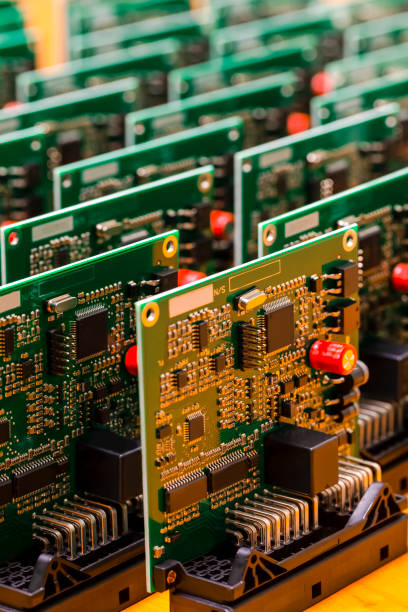 istock Closeup Image of Produced Automotive Printed Circuit Boards with Soldered Surface Mounted Components. Vertical Image Composition 1309128147