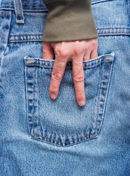 istock Blue jeans pocket with hand in the pocket 1309129363