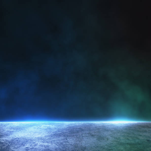 istock Abstract background with dark wall with copyspace and foggy concrete floor illuminated by blue color. Mock up 1309129722