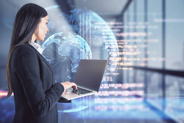 istock Coding and big data concept with businesswoman typing on laptop keyboard and digital screen with world planet and programming code 1309130702