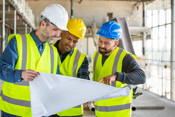 istock Architect, electrician and builder at an indoor construction site 1309130823