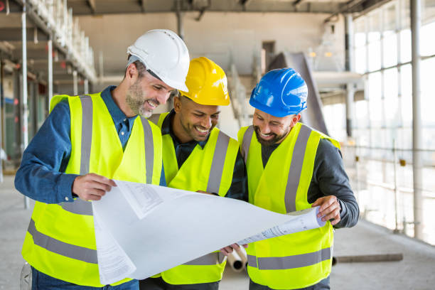 istock Architect, electrician and builder at an indoor construction site 1309130935