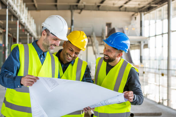 istock Architect, electrician and builder at an indoor construction site 1309130962