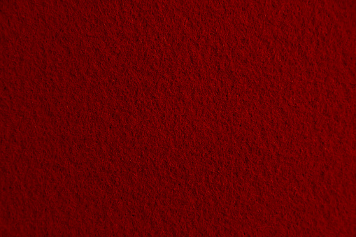 Red matted fabric background from a billboard