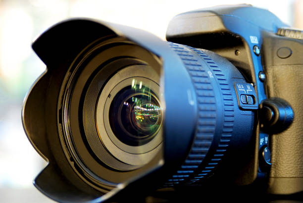 istock Digital camera lying on the table in the store. 1309132540