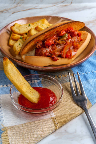 Sausage Onions Peppers Hoagie Sausage onions and peppers hoagie sandwich with side of steak fries torpedo sandwich stock pictures, royalty-free photos & images