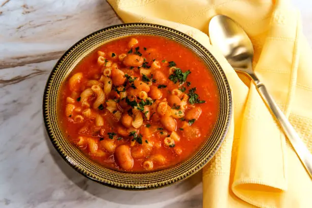 Traditional Italian peasant bean soup pasta e fagioli with elbow macaroni noodles