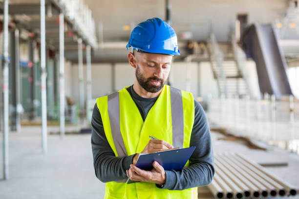 istock Electrician at an indoor construction site 1309133860