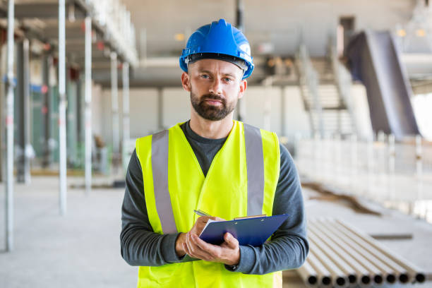 istock Electrician at an indoor construction site 1309133959