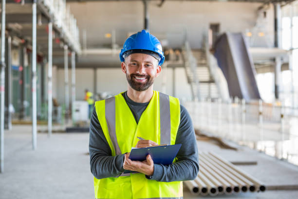 istock Electrician at an indoor construction site 1309134320